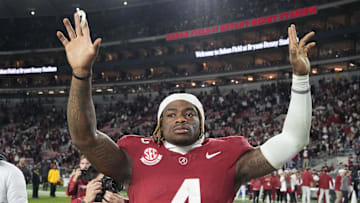 Nov 30, 2024; Tuscaloosa, Alabama, USA;  Alabama Crimson Tide quarterback Jalen Milroe (4) celebrates after defeating the Auburn Tigers at Bryant-Denny Stadium. Alabama won 28-14. Mandatory Credit: Gary Cosby Jr.-Imagn Images