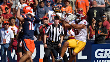 Sep 27, 2025; Champaign, Illinois, USA; Southern California Trojans wide receiver Makai Lemon (6) scores a touchdown on a pass from quarterback Jayden Maiava (14) as Illinois Fighting Illini defensive back Tanner Heckel (16) defends during the second half at Memorial Stadium. Mandatory Credit: Ron Johnson-Imagn Images