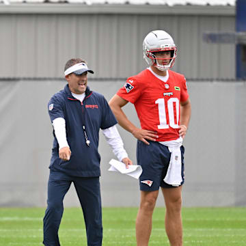 Jun 9, 2025; Foxborough, MA, USA; New England Patriots offensive coordinator Josh McDaniels directs a drill for quarterback Drake Maye (10) during minicamp at Gillette Stadium. Mandatory Credit: Eric Canha-Imagn Images
