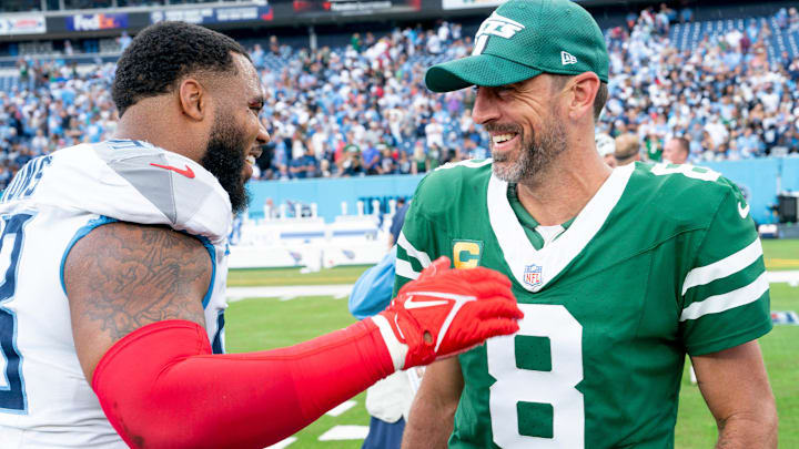 Tennessee Titans defensive tackle Jeffery Simmons (98) and New York Jets quarterback Aaron Rodgers (8) talk after their game at Nissan Stadium in Nashville, Tenn., Sunday, Sept. 15, 2024. The visiting Jets came out on top 24-17.