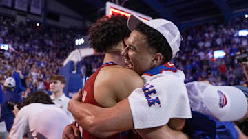 Feb 28, 2023; Lawrence, Kansas, USA; Kansas Jayhawks forward Jalen Wilson (10) and guard Kevin McCullar Jr. (15) embrace after the win over the Texas Tech Red Raiders at Allen Fieldhouse. Mandatory Credit: Denny Medley-Imagn Images