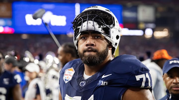 Dec 31, 2024; Glendale, AZ, USA; Penn State Nittany Lions offensive lineman Olaivavega Ioane (71) against the Boise State Broncos during the Fiesta Bowl at State Farm Stadium. Mandatory Credit: Mark J. Rebilas-Imagn Images