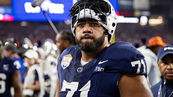 Dec 31, 2024; Glendale, AZ, USA; Penn State Nittany Lions offensive lineman Olaivavega Ioane (71) against the Boise State Broncos during the Fiesta Bowl at State Farm Stadium. Mandatory Credit: Mark J. Rebilas-Imagn Images