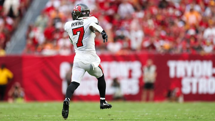 Sep 8, 2024; Tampa, Florida, USA; Tampa Bay Buccaneers running back Bucky Irving (7) runs with the ball against the Washington Commanders in the fourth quarter at Raymond James Stadium. Mandatory Credit: Nathan Ray Seebeck-Imagn Images