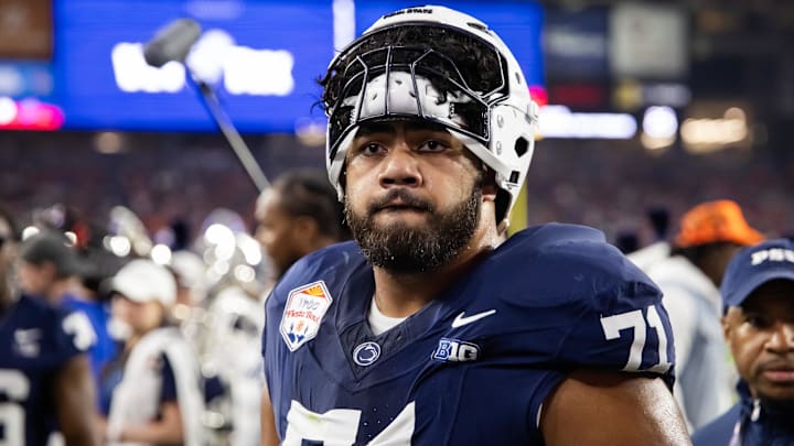 Dec 31, 2024; Glendale, AZ, USA; Penn State Nittany Lions offensive lineman Olaivavega Ioane (71) against the Boise State Broncos during the Fiesta Bowl at State Farm Stadium. Mandatory Credit: Mark J. Rebilas-Imagn Images