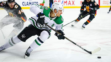 Mar 27, 2025; Calgary, Alberta, CAN; Dallas Stars center Roope Hintz (24) skates with the puck against the Calgary Flames during the first period at Scotiabank Saddledome. Mandatory Credit: Sergei Belski-Imagn Images