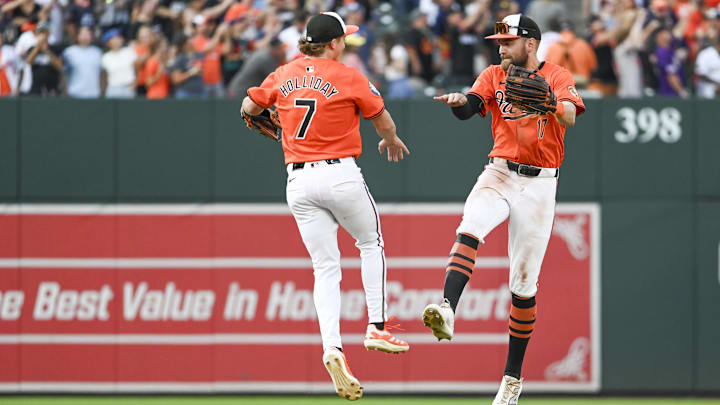 Aug 24, 2024; Baltimore, Maryland, USA; Baltimore Orioles second baseman Jackson Holliday (7) celebrates with outfielder Colton Cowser (17) after the game against the Houston Astros at Oriole Park at Camden Yards.