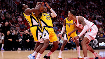 Dec 26, 2023; Houston, Texas, USA; Indiana Pacers forward Aaron Nesmith (23) and Indiana Pacers guard Bennedict Mathurin (00) battle each other for a rebound against the Houston Rockets during the second quarter at Toyota Center. Mandatory Credit: Erik Williams-Imagn Images
