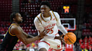 Maryland Terrapins center Derik Queen (25) drives to the basket during the second half against Minnesota Golden Gophers guard Femi Odukale (11) at Xfinity Center.