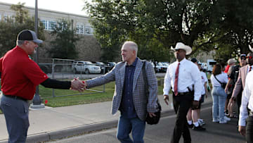 Sep 14, 2024; Lubbock, Texas, USA; Texas Tech Red Raiders head coach Joey McGuire greets fans outside the stadium before a game against the North Texas Mean Green at Jones AT&T Stadium and Cody Campbell Field. Mandatory Credit: Michael C. Johnson-Imagn Images