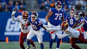 New York Giants running back Tyrone Tracy Jr. (29) breaks a tackle from Washington Commanders cornerback Noah Igbinoghene (1) during a game between the New York Giants and the Washington Commanders at MetLife Stadium in East Rutherford on Sunday, Nov. 3, 2024.
