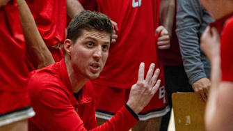 Head coach for Boulder Creek High School, Justin Collard, talks to his team during a timeout at Sandra day O'Connor high school gym in Phoenix on Jan. 26, 2024.