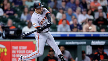 Apr 2, 2025; Houston, Texas, USA; San Francisco Giants designated hitter Wilmer Flores (41) hits a two run home run to left field against the Houston Astros during the first inning at Daikin Park. 