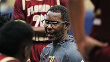 Florida High boys basketball coach Charlie Ward talks to his team during a timeout as the Seminoles beat Plant City during a Capital City Holiday Classic game at TCC's Eagledome on Dec. 21, 2019.

A45c0014
