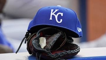 Jul 30, 2021; Toronto, Ontario, CAN; A Kansas City Royals hat and glove in the dugout during a game against the Toronto Blue Jays at Rogers Centre. Mandatory Credit: John E. Sokolowski-Imagn Images