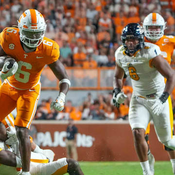 Tennessee running back Dylan Sampson (6) tries to get is foot away from Kent State defensive back Armahn Hale (29) during a NCAA game between Tennessee and Kent State in Neyland Stadium in Knoxville on Saturday, Sept. 14, 2024.