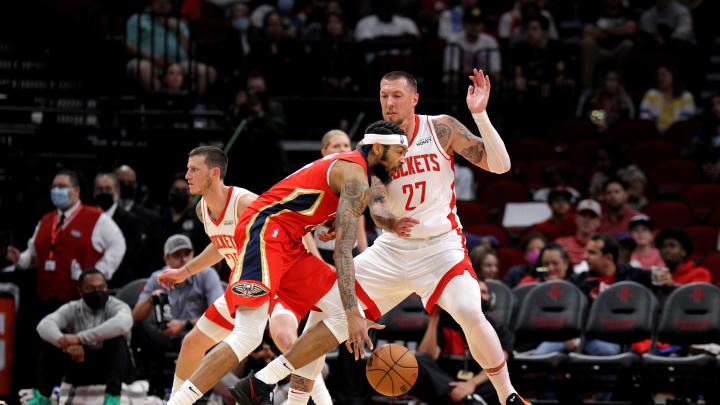 Dec 5, 2021; Houston, Texas, USA; New Orleans Pelicans forward Brandon Ingram (14) drives to the basket while Houston Rockets center Daniel Theis (27) defends during the third quarter at Toyota Center. Mandatory Credit: Erik Williams-USA TODAY Sports