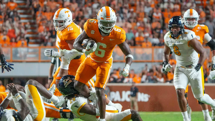 Tennessee running back Dylan Sampson (6) tries to get is foot away from Kent State defensive back Armahn Hale (29) during a NCAA game between Tennessee and Kent State in Neyland Stadium in Knoxville on Saturday, Sept. 14, 2024.