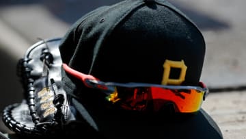 Apr 23, 2022; Chicago, Illinois, USA; A detail view of the glove, hat, and sunglasses of Pittsburgh
