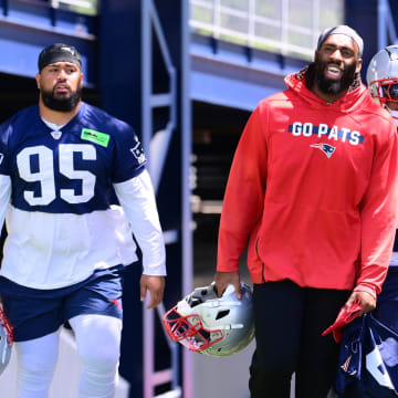 Jun 10, 2024; Foxborough, MA, USA;  New England Patriots linebacker Matthew Judon (9) (red) heads to the practice field at minicamp at Gillette Stadium. Mandatory Credit: Eric Canha-USA TODAY Sports