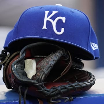 Jul 30, 2021; Toronto, Ontario, CAN; A Kansas City Royals hat and glove in the dugout during a game against the Toronto Blue Jays at Rogers Centre. Mandatory Credit: John E. Sokolowski-Imagn Images