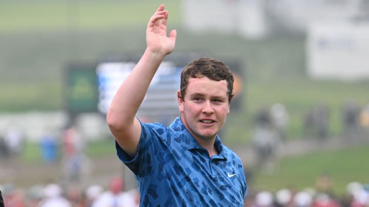 Jun 2, 2024; Hamilton, Ontario, CAN;  Robert MacIntyre waves to fans after winning the RBC Canadian Open golf tournament. Mandatory Credit: Dan Hamilton-USA TODAY Sports