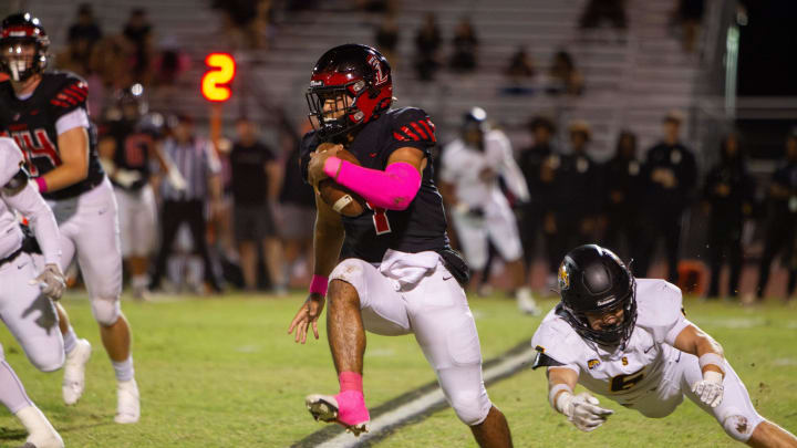 Navi Bruzon, No. 7, escapes a tackle from Saguaro at Liberty High School football field in Peoria on Oct. 20, 2023.