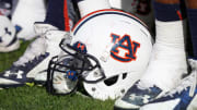 Jan 1, 2015; Tampa, FL, USA; Auburn Tigers helmet lays on the field by the bench against the Wisconsin Badgers during the second half in the 2015 Outback Bowl at Raymond James Stadium. Wisconsin Badgers defeated the Auburn Tigers 34-31 in overtime.