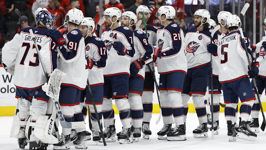 Apr 13, 2025; Washington, District of Columbia, USA; Columbus Blue Jackets goaltender Jet Greaves (73) celebrates with teammates after their game against the Washington Capitals at Capital One Arena. Mandatory Credit: Geoff Burke-Imagn Images