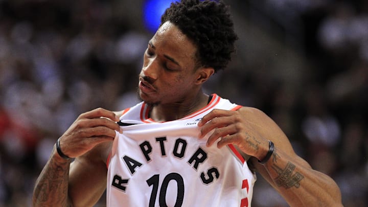 Apr 17, 2018; Toronto, Ontario, CAN; Toronto Raptors guard DeMar DeRozan (10) checks his jersey during a break in the action against the Washington Wizards in game two of the first round of the 2018 NBA Playoffs at Air Canada Centre. Toronto defeated Washington. Mandatory Credit: John E. Sokolowski-Imagn Images