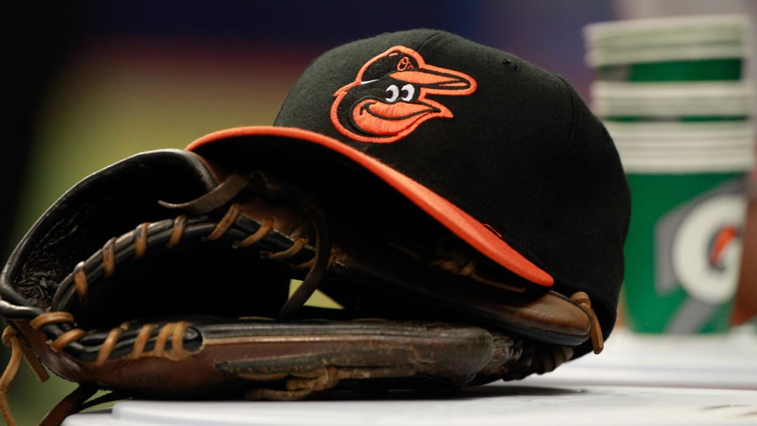 Apr 6, 2015; St. Petersburg, FL, USA; A general view of Baltimore Orioles glove and hat lays in the dugout against the Tampa Bay Rays at Tropicana Field.