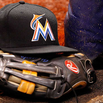 Jun 4, 2014; St. Petersburg, FL, USA; Miami Marlins hat and glove lay in the dugout against the Tampa Bay Rays at Tropicana Field.