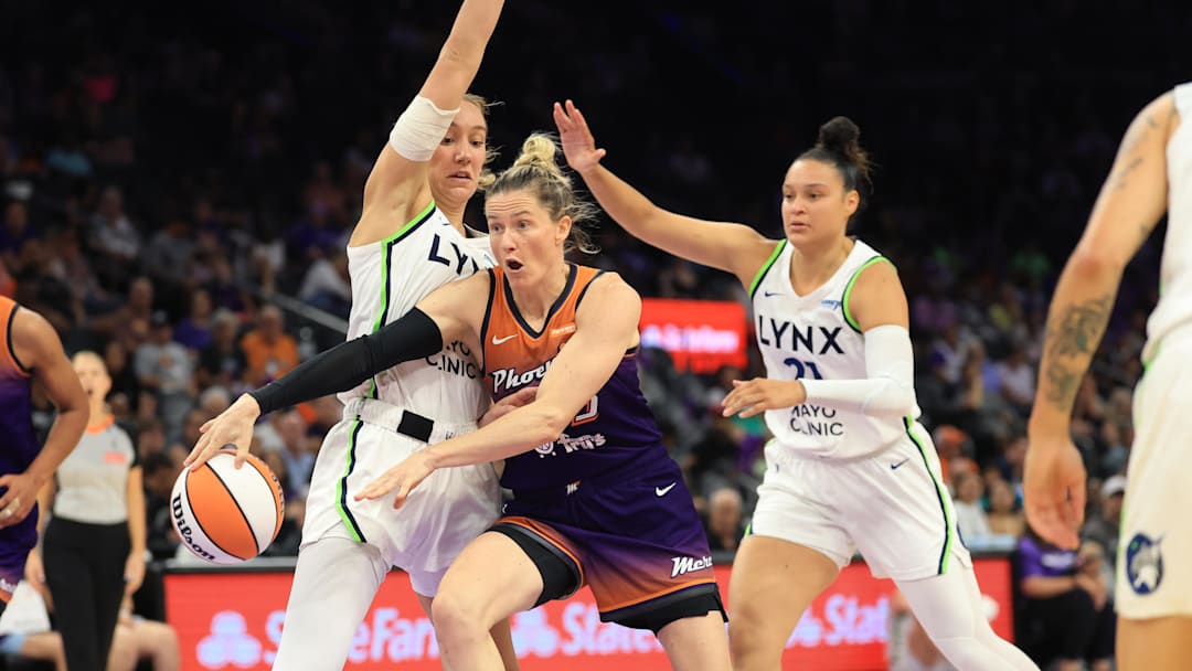 Jul 9, 2025; Phoenix, Arizona, USA; Minnesota Lynx forward Alanna Smith (8) and guard Kayla McBride (21) defend against Phoenix Mercury guard Sami Whitcomb (23) during the first half at PHX Arena. Mandatory Credit: Mark J. Rebilas-Imagn Images