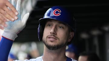 Oct 2, 2025; Chicago, Illinois, USA; Chicago Cubs outfielder Kyle Tucker (30) is greeted in the dugout after scoring against the San Diego Padres during game three of the Wildcard round for the 2025 MLB playoffs at Wrigley Field.