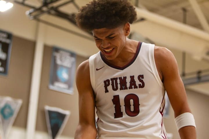 Koa Peat (10) celebrates his teammates' score at the LV8 Invitational at Chandler-Gilbert Community College gym. 