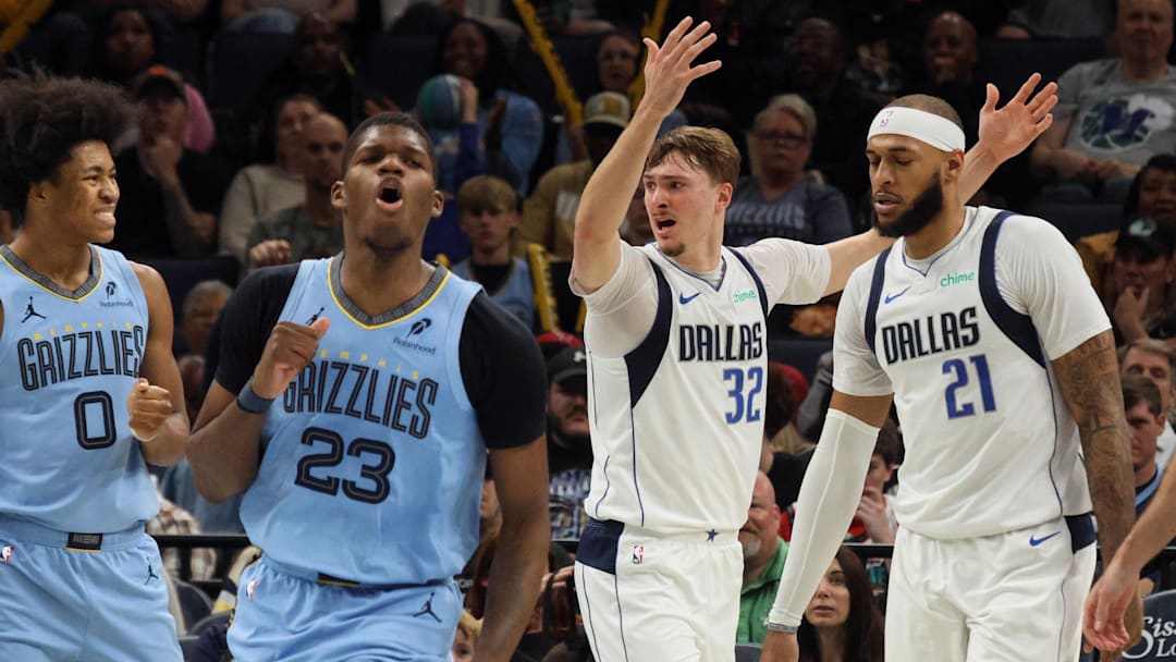 Nov 7, 2025; Memphis, Tennessee, USA; Dallas Mavericks forward Cooper Flagg (32) and Memphis Grizzlies forward Cedric Coward (23) react during the second quarter against the Memphis Grizzlies at FedExForum. Mandatory Credit: Petre Thomas-Imagn Images