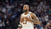 Apr 27, 2025; Minneapolis, Minnesota, USA; Los Angeles Lakers forward LeBron James (23) talks with his coach during a stoppage in play against the Minnesota Timberwolves in the second quarter during game four of first round for the 2025 NBA Playoffs at Target Center. Mandatory Credit: Matt Blewett-Imagn Images
