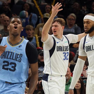Nov 7, 2025; Memphis, Tennessee, USA; Dallas Mavericks forward Cooper Flagg (32) and Memphis Grizzlies forward Cedric Coward (23) react during the second quarter against the Memphis Grizzlies at FedExForum. Mandatory Credit: Petre Thomas-Imagn Images