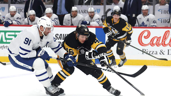 Nov 29, 2025; Pittsburgh, Pennsylvania, USA;  Toronto Maple Leafs center John Tavares (91) defends Pittsburgh Penguins center Blake Lizotte (46) during the first period  at PPG Paints Arena. Mandatory Credit: Charles LeClaire-Imagn Images