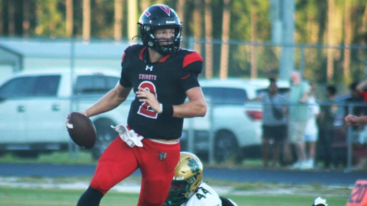 Creekside quarterback Sean Ashenfelder (2) steps away from Nease pass rusher Devon Wentley (44) in a high school football game on August 30, 2024. [Clayton Freeman/Florida Times-Union]