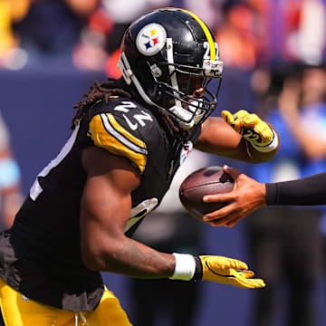 Sep 15, 2024; Denver, Colorado, USA; Pittsburgh Steelers quarterback Justin Fields (2) hands off to running back Najee Harris (22) in the first quarter against the Denver Broncos at Empower Field at Mile High. Mandatory Credit: Ron Chenoy-Imagn Images