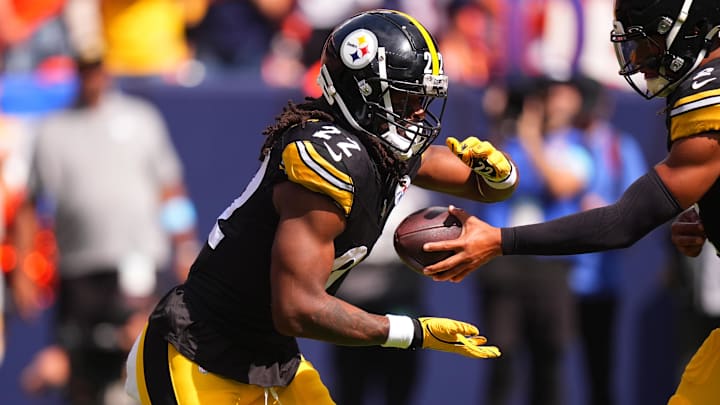 Sep 15, 2024; Denver, Colorado, USA; Pittsburgh Steelers quarterback Justin Fields (2) hands off to running back Najee Harris (22) in the first quarter against the Denver Broncos at Empower Field at Mile High. Mandatory Credit: Ron Chenoy-Imagn Images