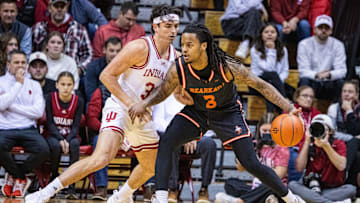 Dec 3, 2024; Bloomington, Indiana, USA; Sam Houston State Bearkats guard Lamar Wilkerson (3) dribbles the ball while Indiana Hoosiers guard Trey Galloway (32) defends in the first half at Simon Skjodt Assembly Hall. Mandatory Credit: Trevor Ruszkowski-Imagn Images