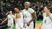 Oregon’s Oregon’s Peyton Scott, left, Deja Kelly, Phillipina Kyei and Elisa Mevius celebrate the Duck’s win over Rutgers at Matthew Knight Arena Sunday, Feb. 23, 2025 in Eugene, Oregon.