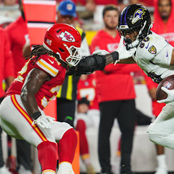 Baltimore Ravens tight end Isaiah Likely (80) runs with the ball against Kansas City Chiefs linebacker Nick Bolton (32) during the second half at GEHA Field at Arrowhead Stadium. 