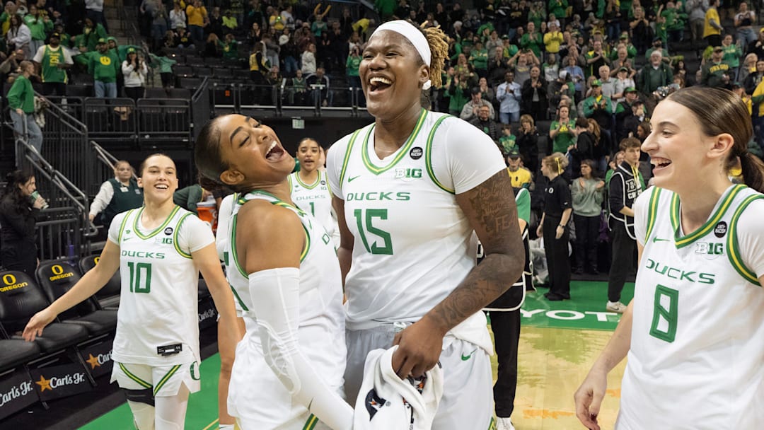 Oregon’s Oregon’s Peyton Scott, left, Deja Kelly, Phillipina Kyei and Elisa Mevius celebrate the Duck’s win over Rutgers at Matthew Knight Arena Sunday, Feb. 23, 2025, in Eugene, Oregon.