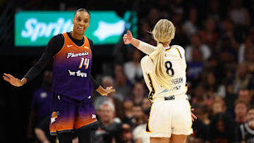Aug 7, 2025; Phoenix, Arizona, USA; Indiana Fever guard Sophie Cunningham (8) reacts alongside Phoenix Mercury forward DeWanna Bonner (14) in the first half of a WNBA game at PHX Arena. Mandatory Credit: Mark J. Rebilas-Imagn Images