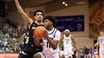 Nov 25, 2024; Lahaina, Hawaii, USA;  Colorado Buffaloes guard RJ Smith (5) defends Michigan State Spartans guard Jase Richardson (11) in the first half of an NCAA college basketball game at Lahaina Civic Center. Mandatory Credit: Marco Garcia-Imagn Images