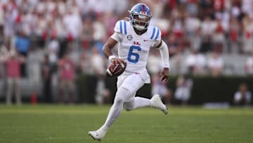 Mississippi Rebels quarterback Trinidad Chambliss (6) runs the ball against the Georgia Bulldogs during the third quarter of the game at Sanford Stadium. Credit: Brett Davis-Imagn Images