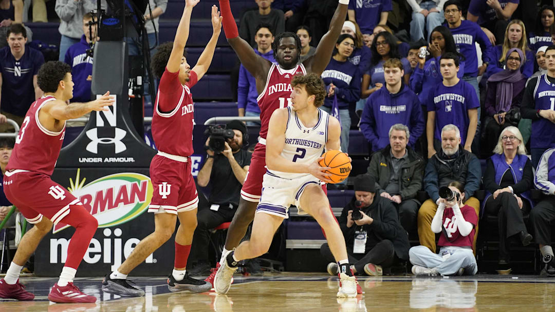 Jan 22, 2025; Evanston, Illinois, USA; Indiana Hoosiers center Oumar Ballo (11) defends Northwestern Wildcats forward Nick Martinelli (2) during the first half at Welsh-Ryan Arena. Mandatory Credit: David Banks-Imagn Images
